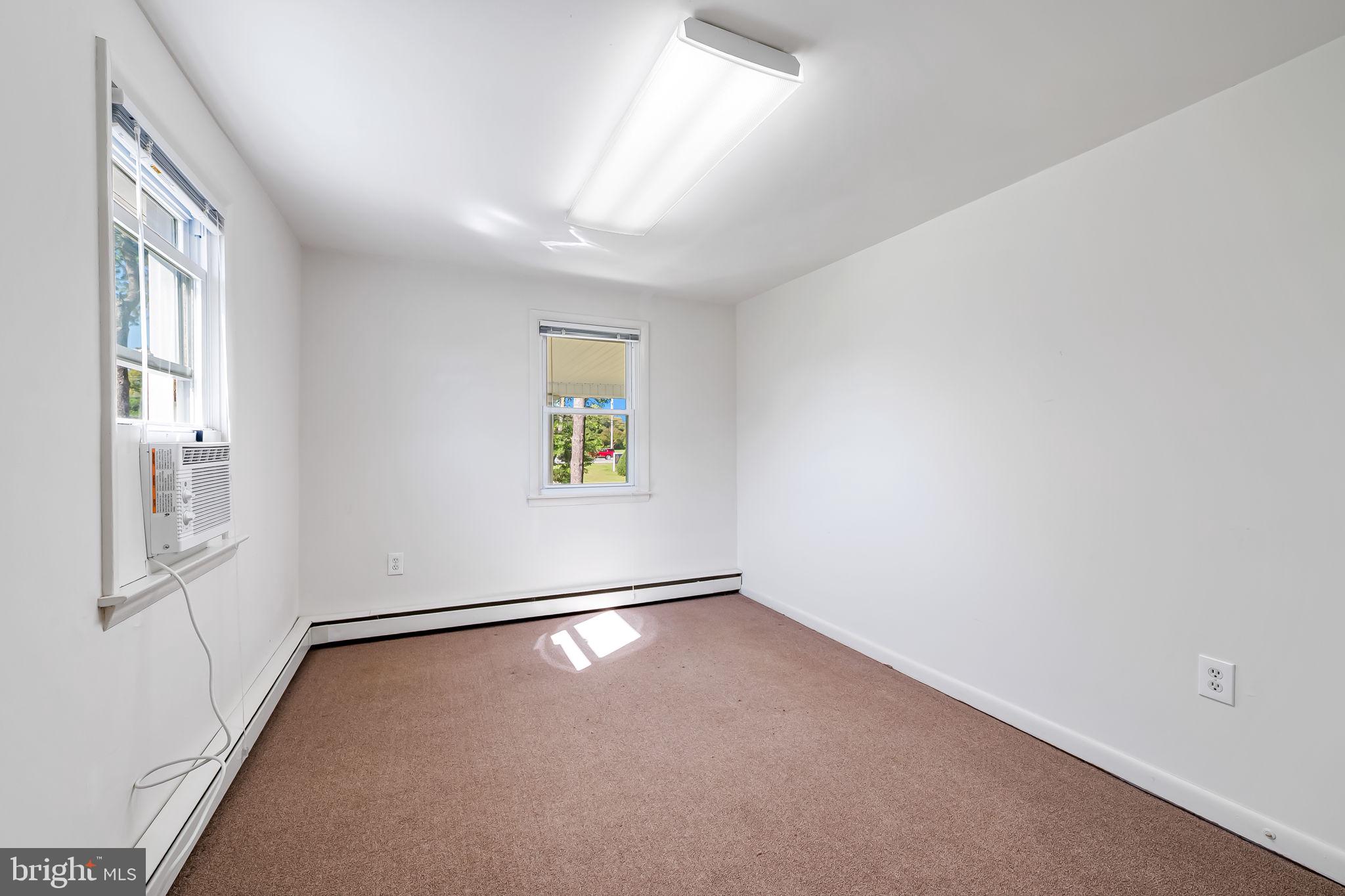 315 Brick Church Road Davidsonville, MD 21035 - Photo 22 of 45 an empty room with windows