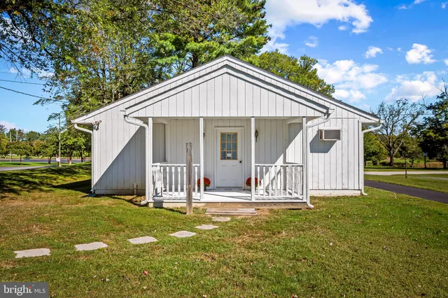 a view of a house with wooden fence and floor