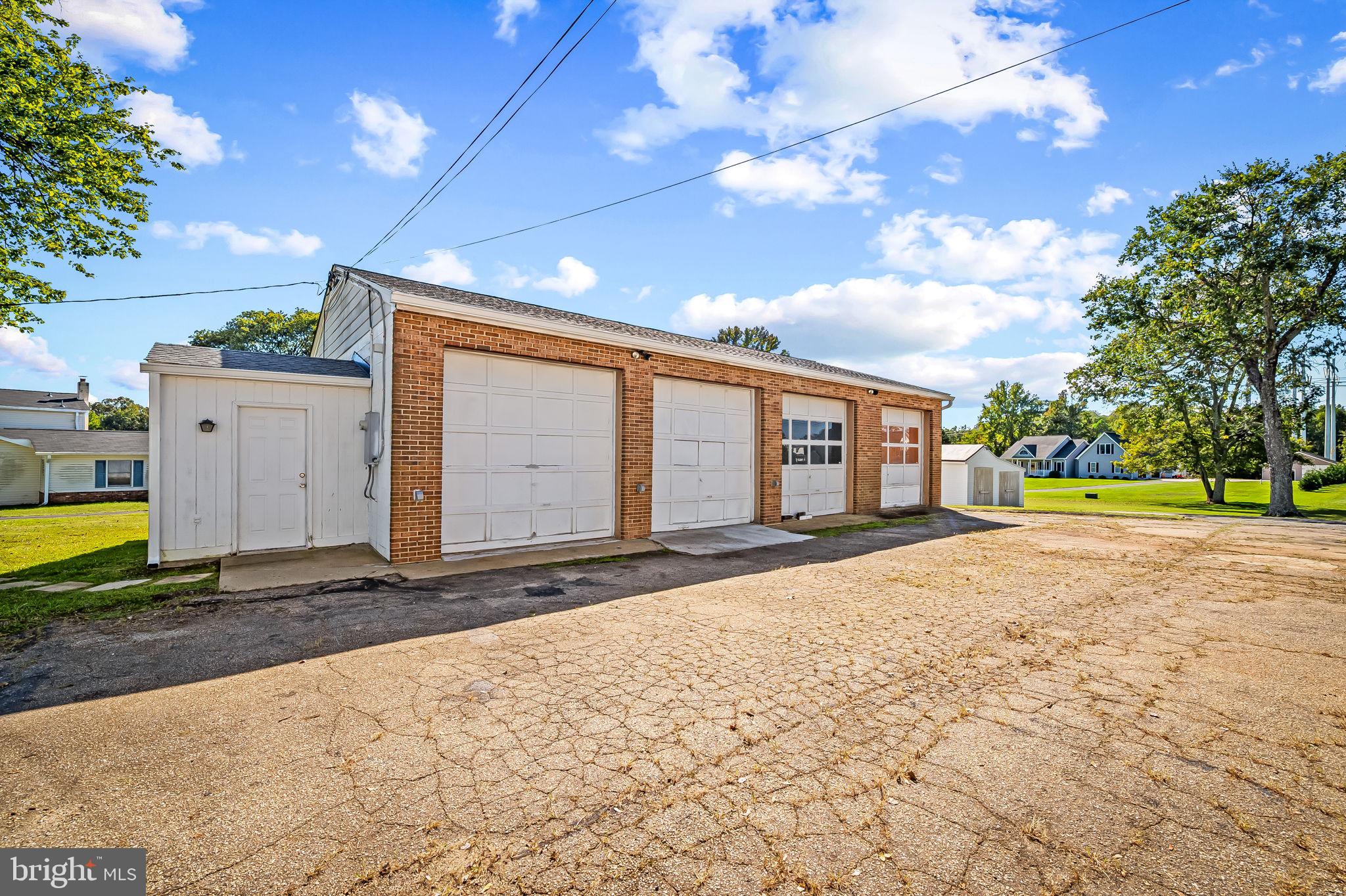 315 Brick Church Road Davidsonville, MD 21035 - Photo 28 of 45 a front view of a house with a yard and garage