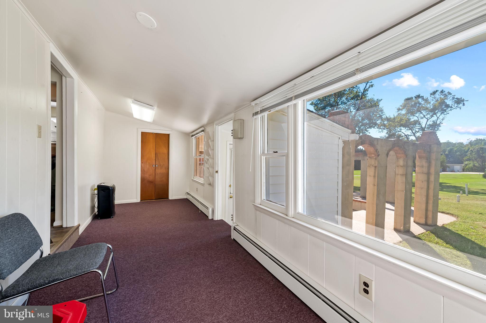 315 Brick Church Road Davidsonville, MD 21035 - Photo 9 of 45 a living room with furniture and a large window