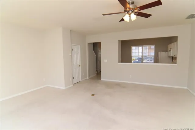 a view of an empty room with a window