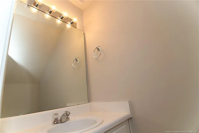 a bathroom with a sink and shower