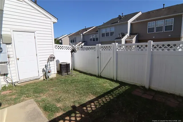 a house view with a backyard space