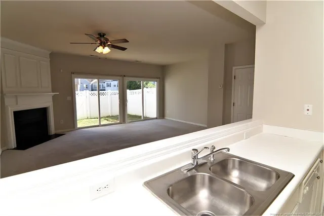 a kitchen with a sink and a window
