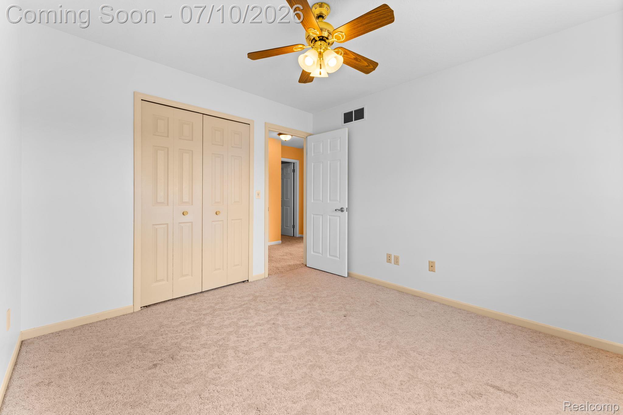 3144 North Nicholson Road Fowlerville, MI 48836 - Photo 46 of 70 Carpeted room featuring a ceiling fan with integrated lighting, a double bi-fold closet, and baseboard trim