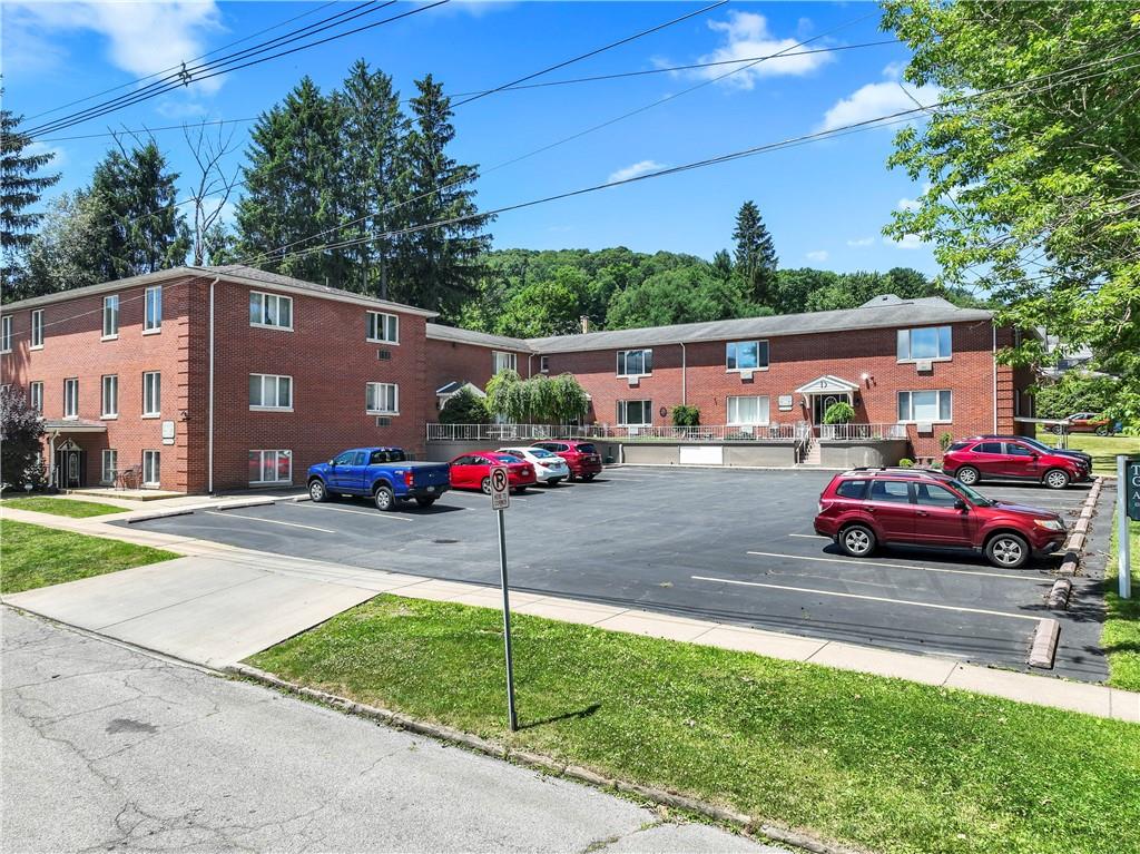 302 15th Street Franklin, PA 16323 - Photo 1 of 11 a front view of a house with a garden and parking
