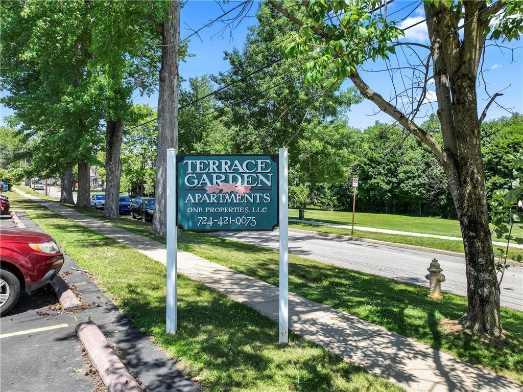 302 15th Street Franklin, PA 16323 - Photo 3 of 11 a view of a park with large trees and a pathway