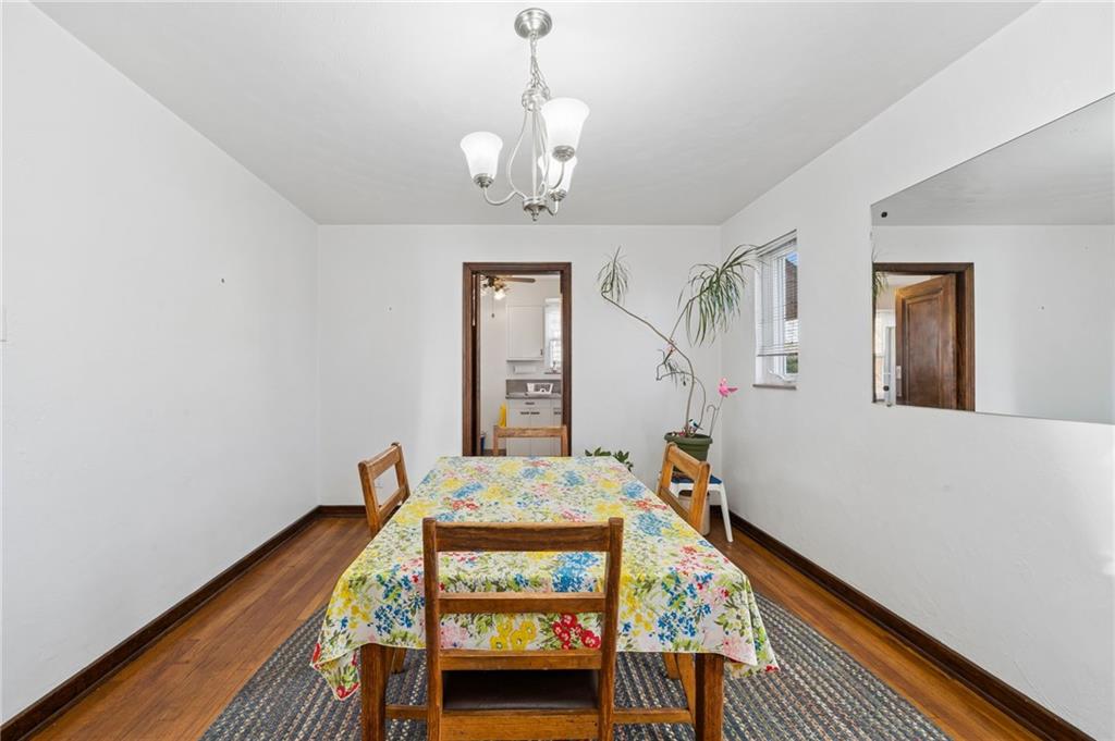 317 Raymond Street Pittsburgh, PA 15218 - Photo 11 of 36 a bedroom with furniture and a wooden floor