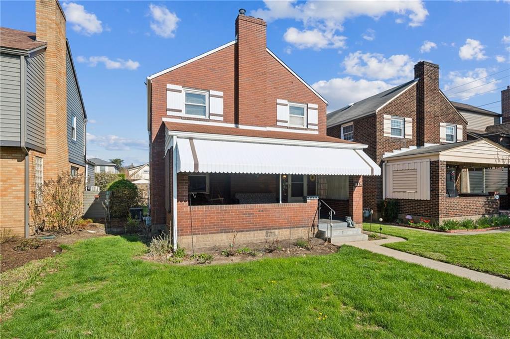 317 Raymond Street Pittsburgh, PA 15218 - Photo 2 of 36 a view of a house with a yard and sitting area