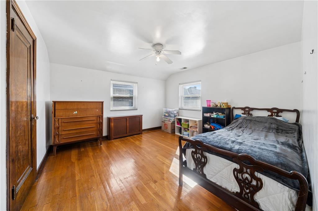 317 Raymond Street Pittsburgh, PA 15218 - Photo 21 of 36 a living room with furniture and a wooden floor