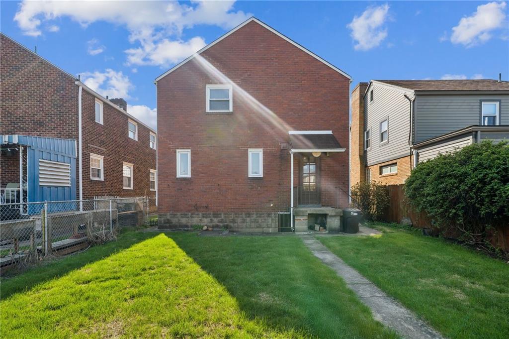 317 Raymond Street Pittsburgh, PA 15218 - Photo 30 of 36 a brick building with a yard