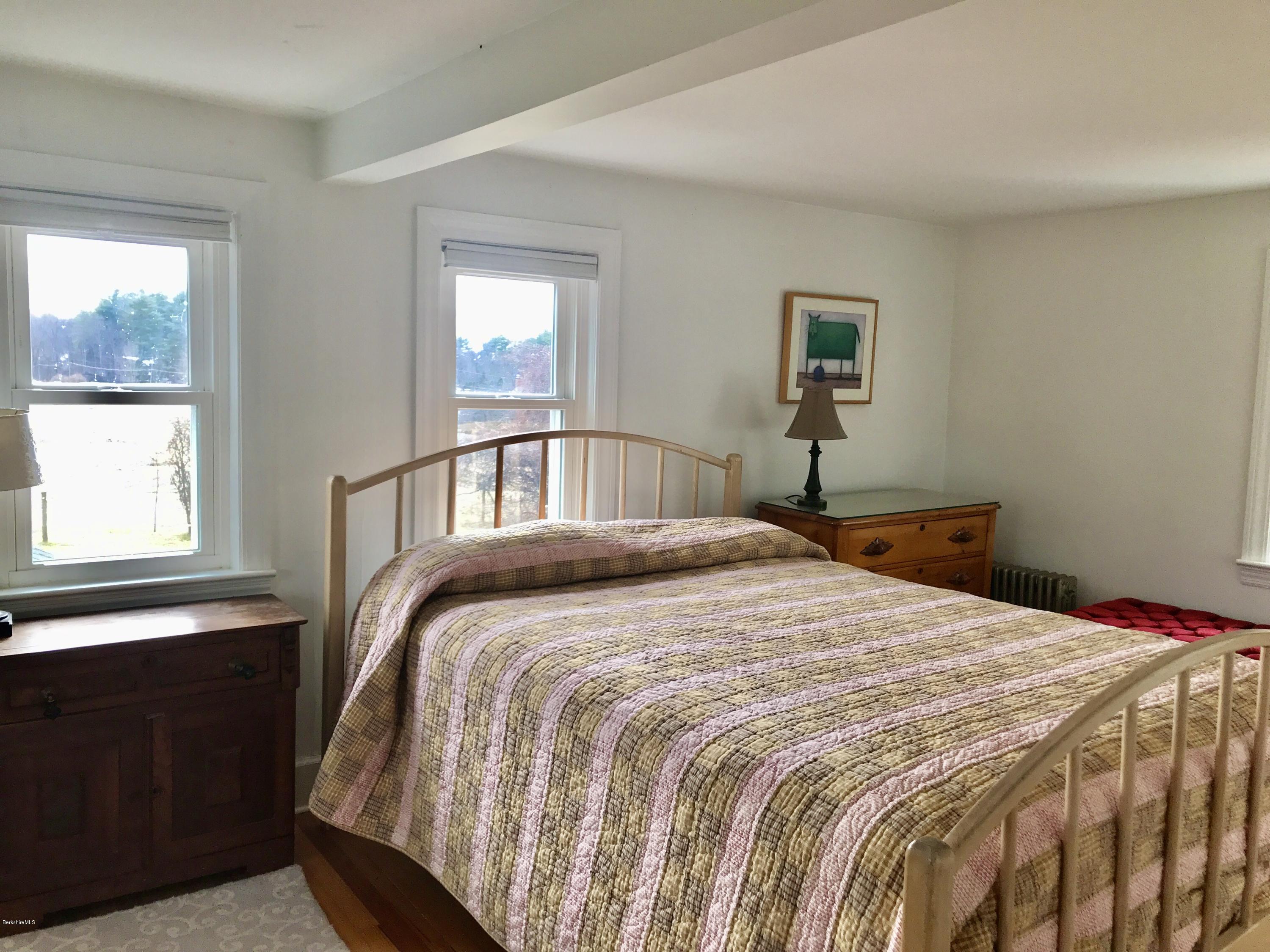 1679 Swamp Road Richmond, MA 01254 - Photo 17 of 33 a bedroom with a bed and a window