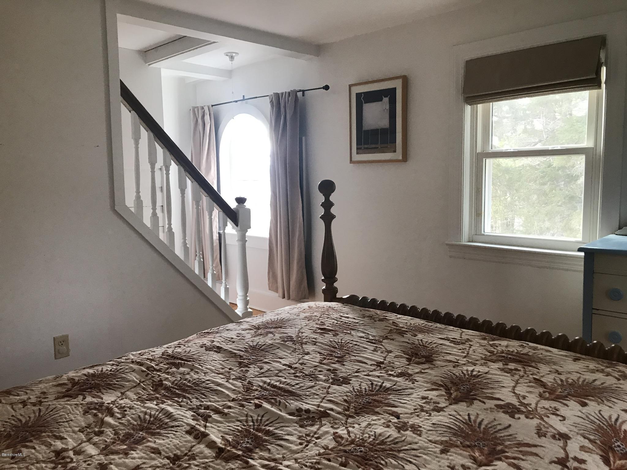 1679 Swamp Road Richmond, MA 01254 - Photo 22 of 33 a view of a livingroom with wooden floor and stairs