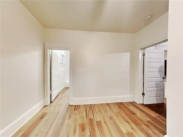 a view of wooden floor with brick walls