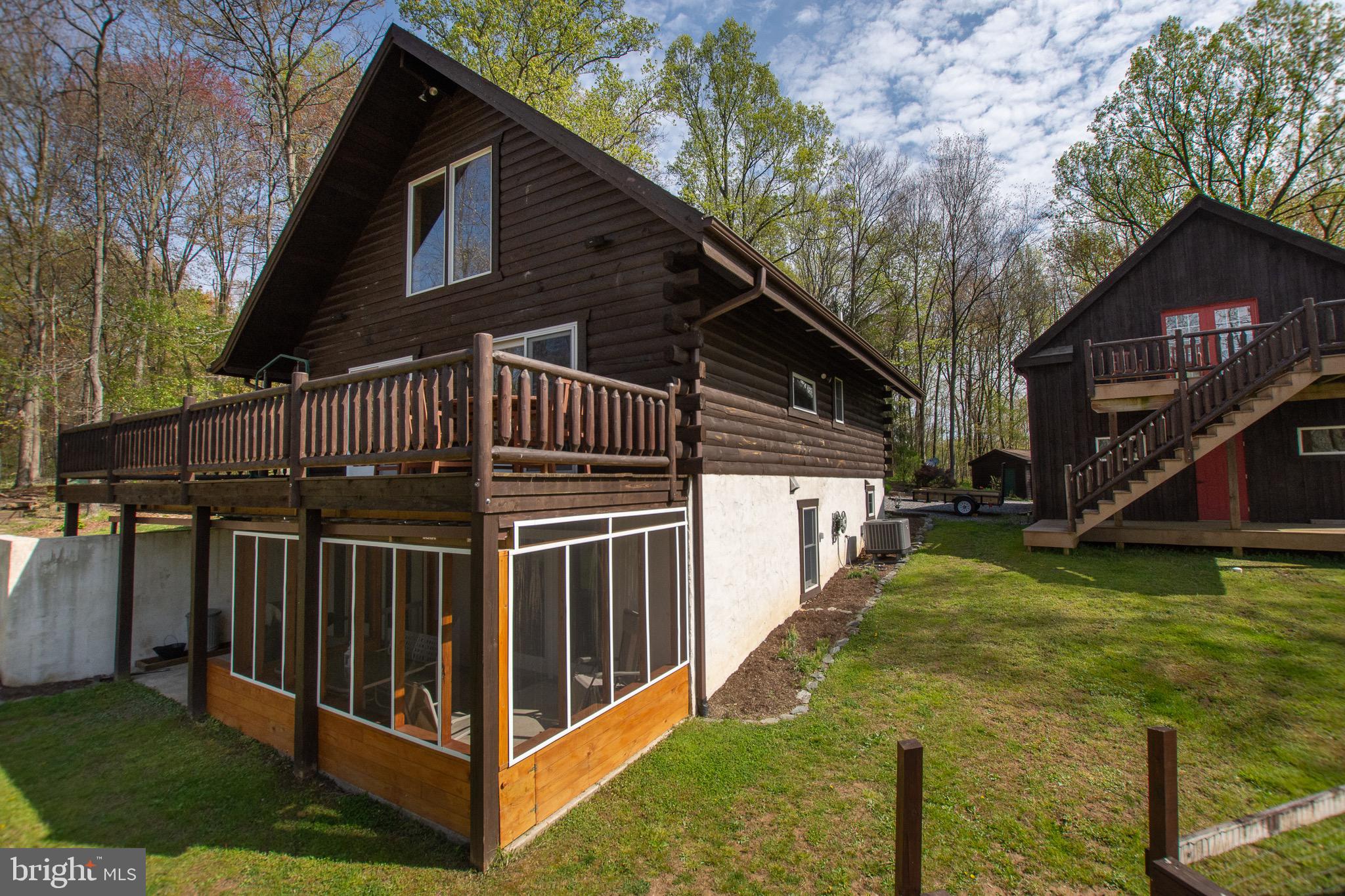 232 Wesley Road Quarryville, PA 17566 - Photo 8 of 69 Screened porch great to enjoy bug free and dry.