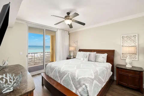 a bedroom with a large bed and a window