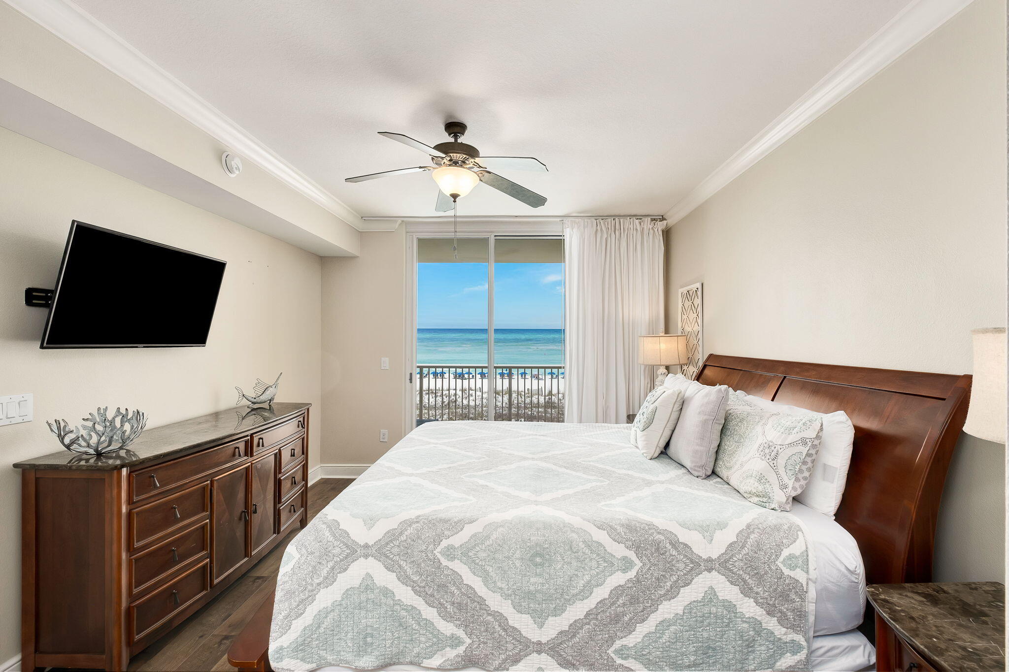 1150 Santa Rosa Boulevard, Unit 305 Fort Walton Beach, FL 32548 - Photo 13 of 43 a bedroom with a bed and a flat screen tv