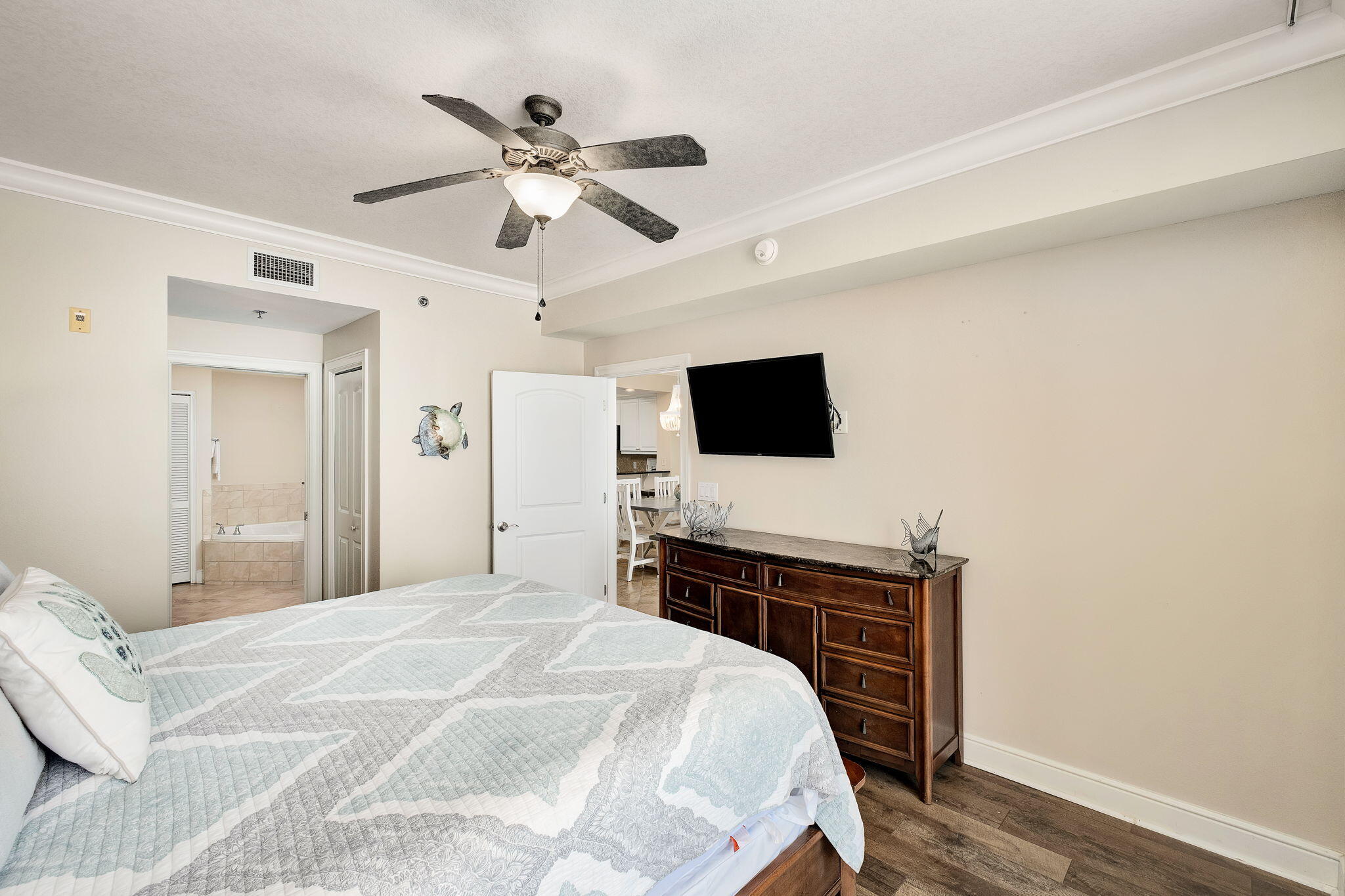 1150 Santa Rosa Boulevard, Unit 305 Fort Walton Beach, FL 32548 - Photo 14 of 43 a bedroom with a bed and a flat screen tv
