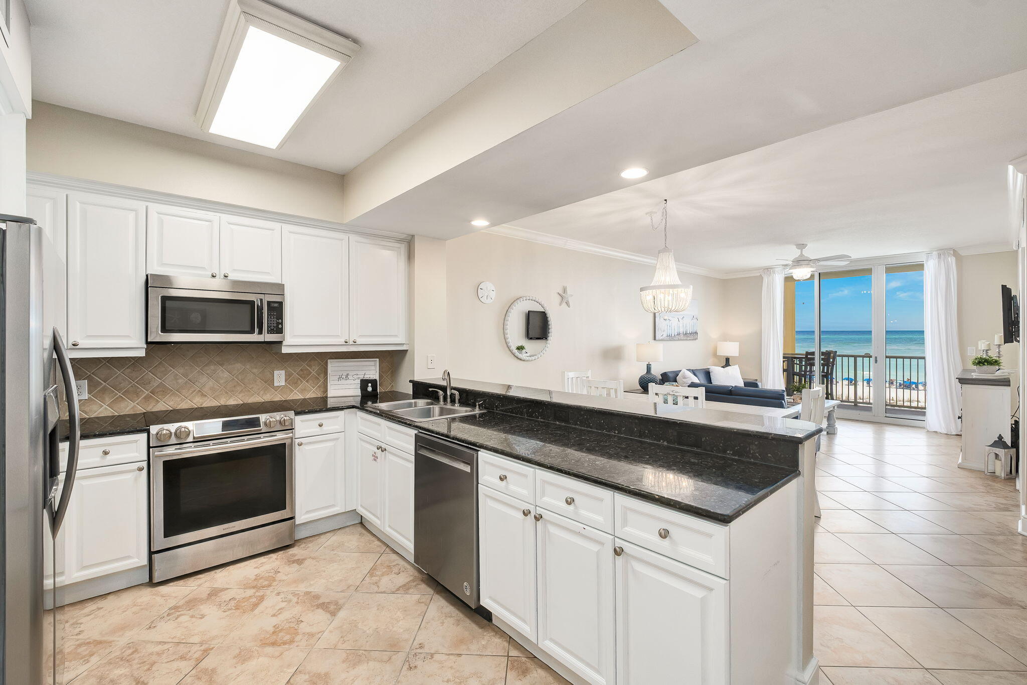 1150 Santa Rosa Boulevard, Unit 305 Fort Walton Beach, FL 32548 - Photo 19 of 43 a kitchen with a stove sink and cabinets