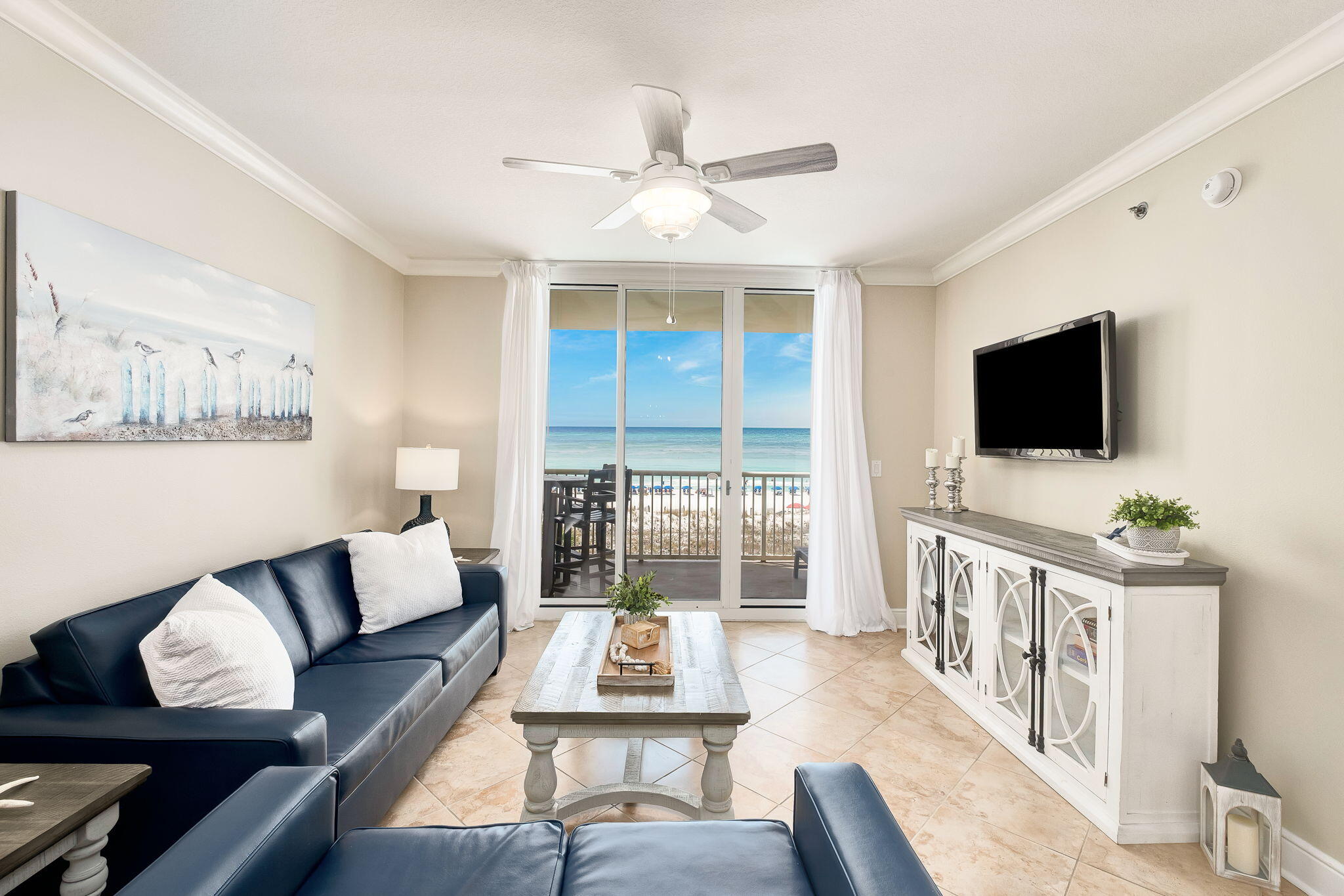 1150 Santa Rosa Boulevard, Unit 305 Fort Walton Beach, FL 32548 - Photo 2 of 43 a living room with furniture and a flat screen tv