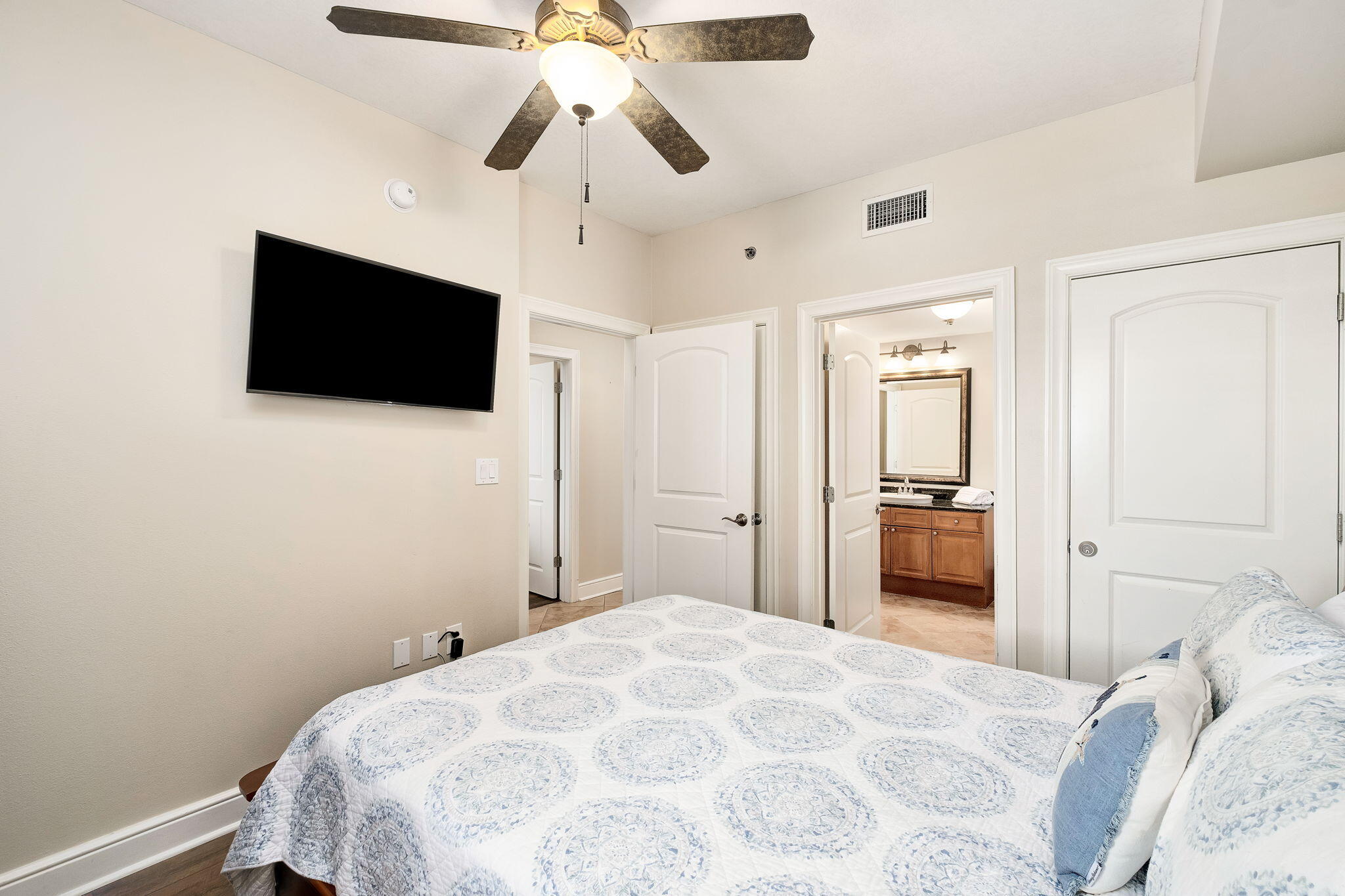 1150 Santa Rosa Boulevard, Unit 305 Fort Walton Beach, FL 32548 - Photo 23 of 43 a bedroom with a bed and a flat screen tv