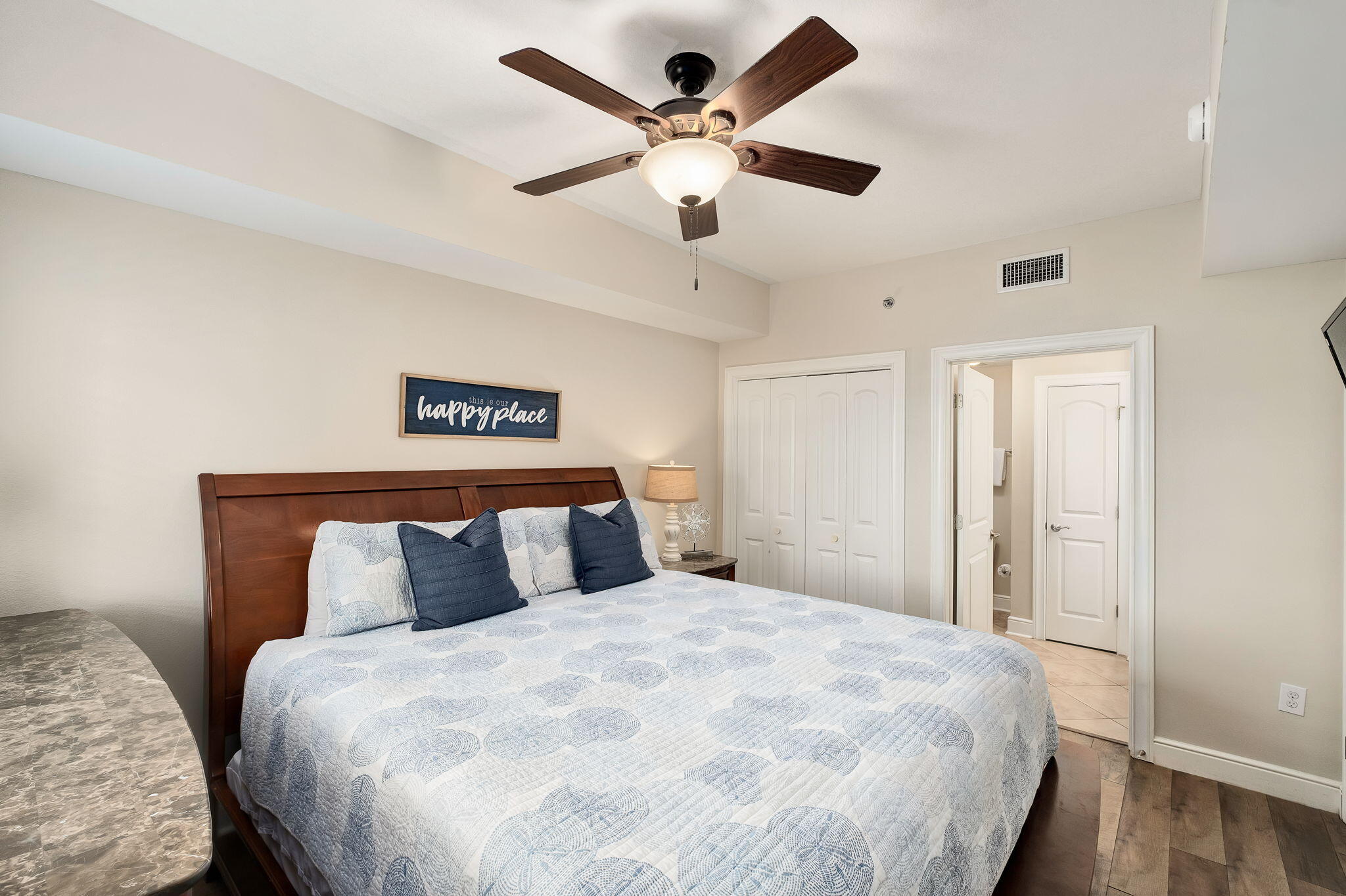 1150 Santa Rosa Boulevard, Unit 305 Fort Walton Beach, FL 32548 - Photo 25 of 43 a bedroom with a large bed and a ceiling fan