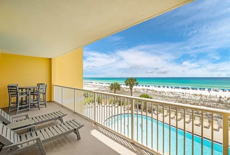 a view of a balcony with chairs