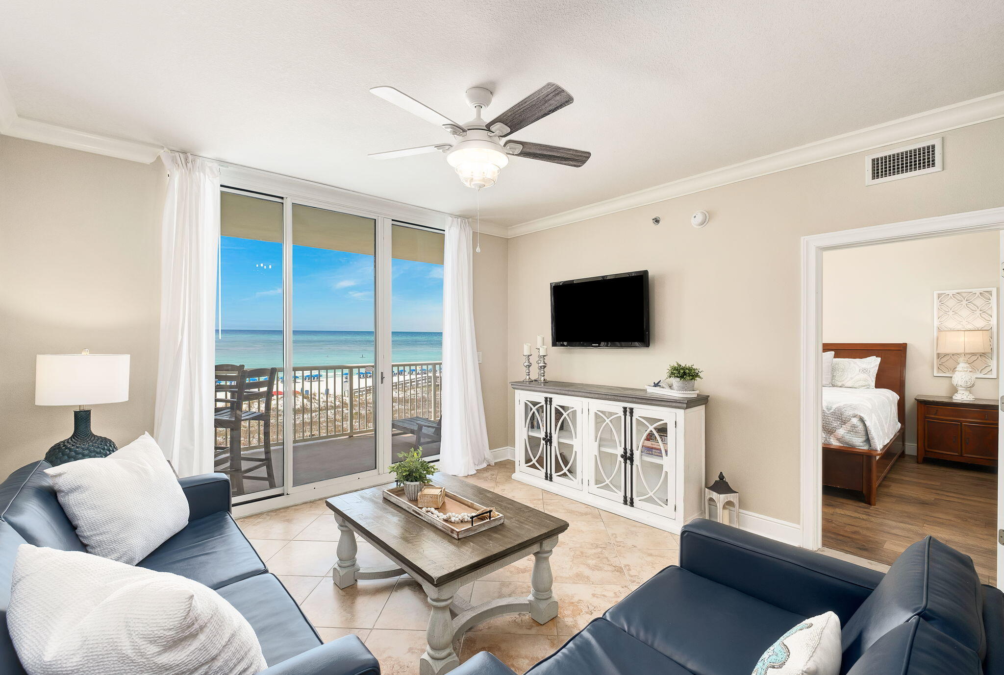 1150 Santa Rosa Boulevard, Unit 305 Fort Walton Beach, FL 32548 - Photo 7 of 43 a living room with furniture and a flat screen tv