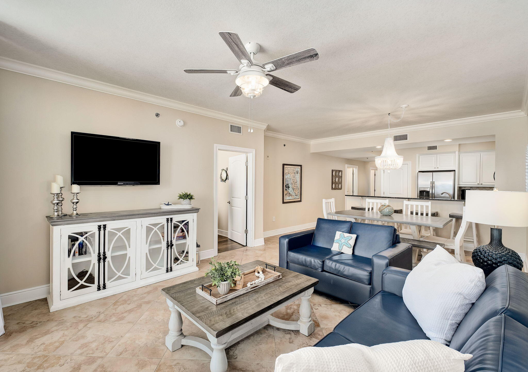 1150 Santa Rosa Boulevard, Unit 305 Fort Walton Beach, FL 32548 - Photo 8 of 43 a living room with furniture and a flat screen tv