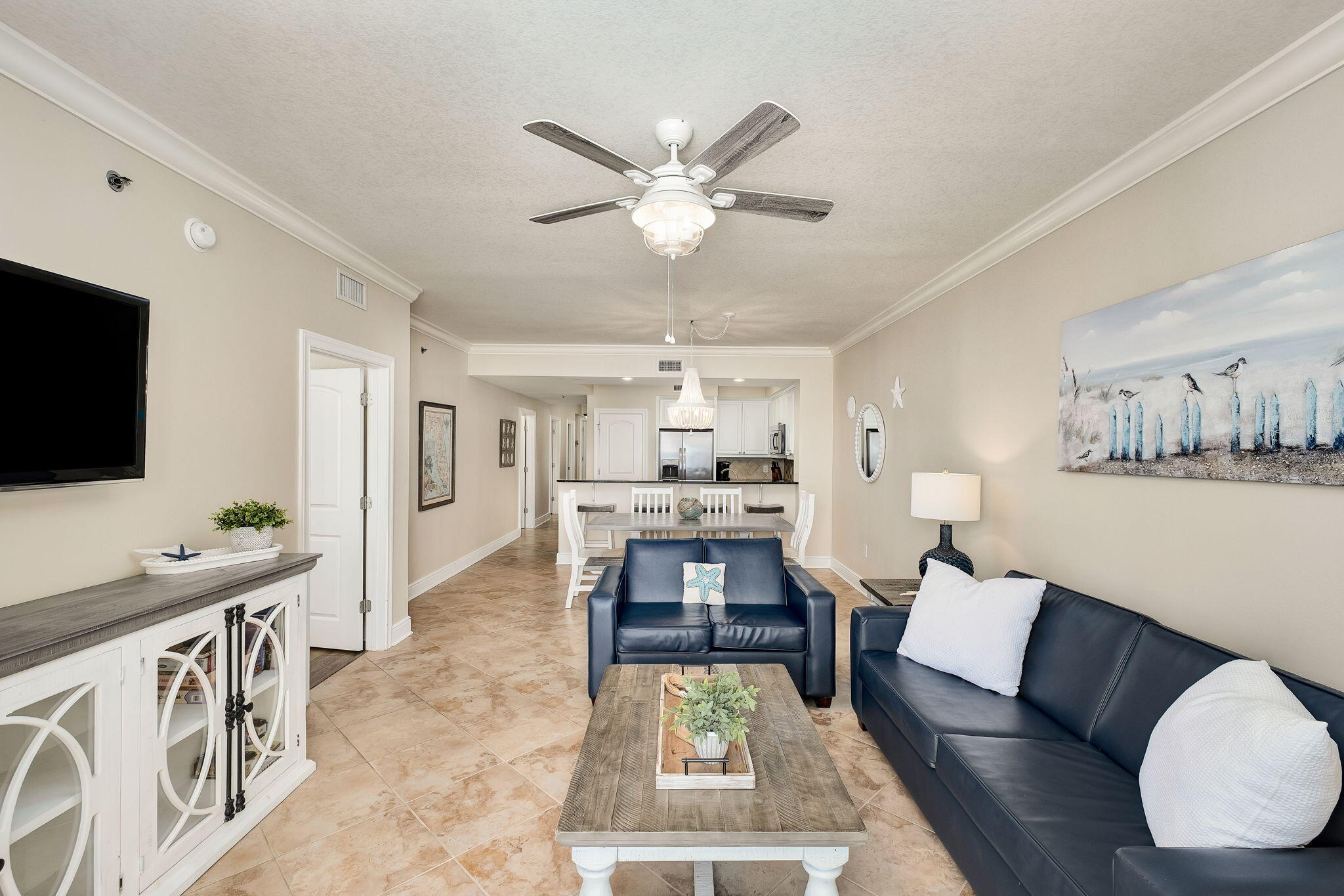1150 Santa Rosa Boulevard, Unit 305 Fort Walton Beach, FL 32548 - Photo 10 of 43 a living room with furniture and a flat screen tv