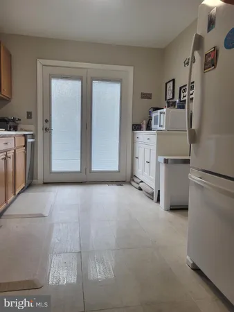 a view of a kitchen with washer and dryer
