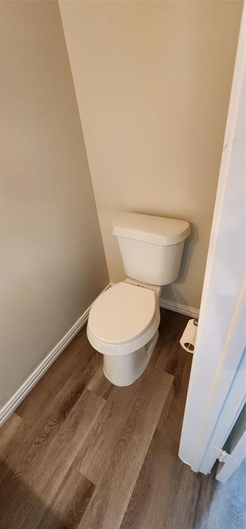 716 Violet Court Mesquite, TX 75150 - Photo 17 of 19 a white toilet sitting next to a shower