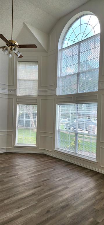 716 Violet Court Mesquite, TX 75150 - Photo 4 of 19 an empty room with wooden floor and windows
