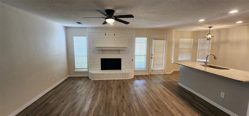 716 Violet Court Mesquite, TX 75150 - Photo 8 of 19 a view of kitchen with granite countertop stove top oven and sink