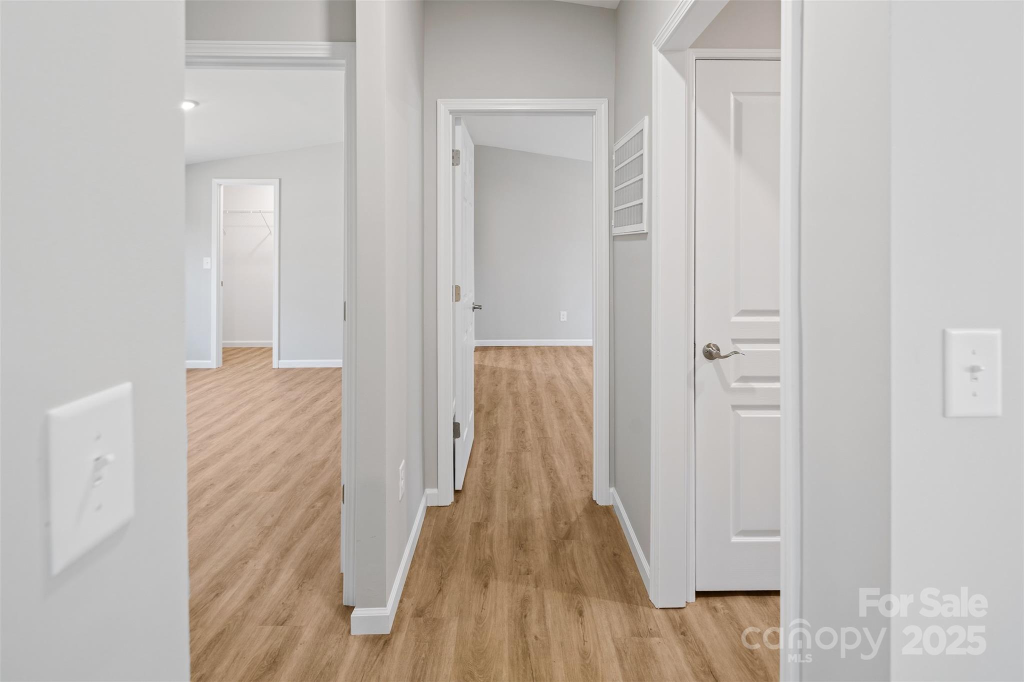 166 Brook Creek Drive Troutman, NC 28166 - Photo 20 of 26 a view of a hallway with wooden floor and closet area