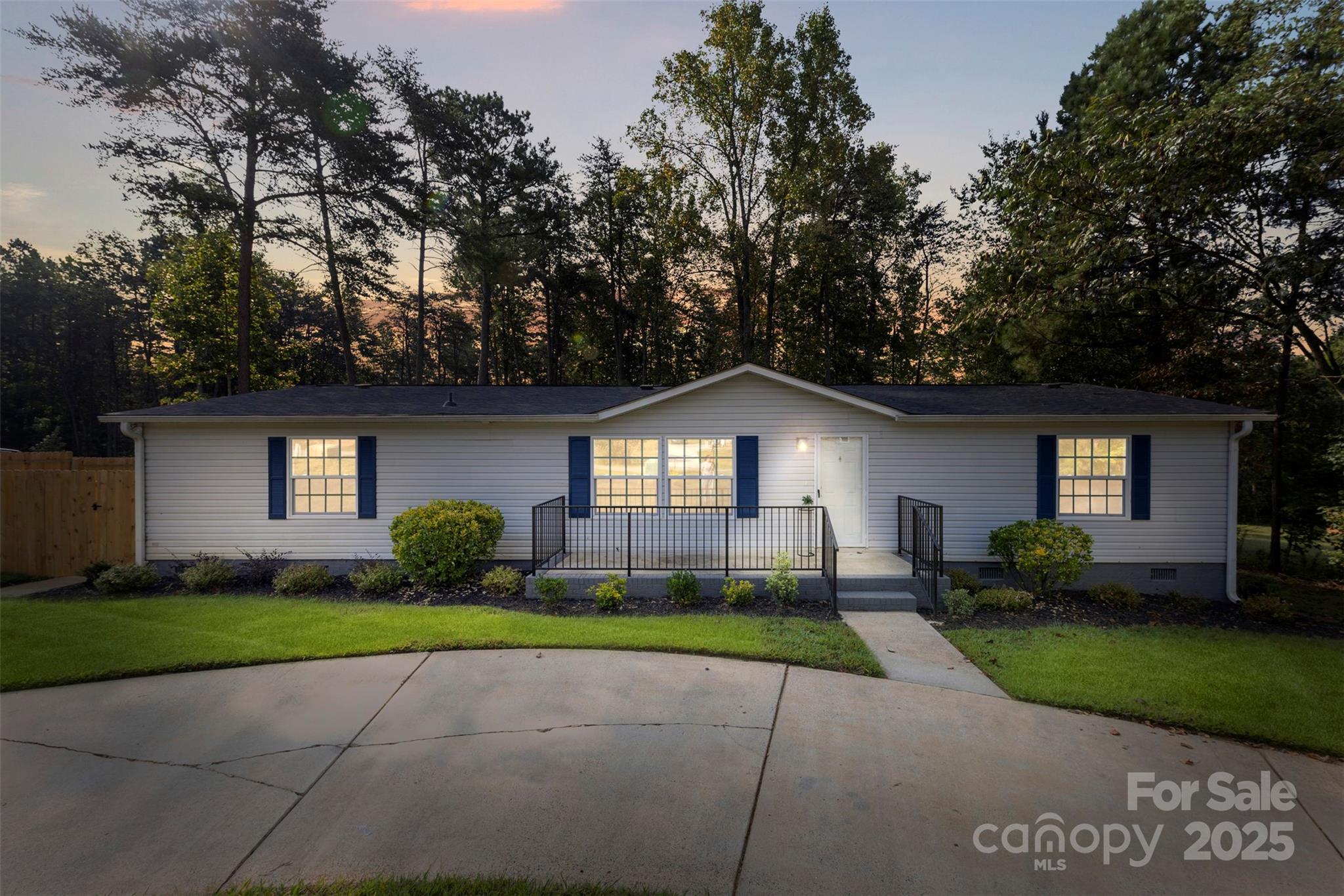 166 Brook Creek Drive Troutman, NC 28166 - Photo 2 of 26 a front view of a house with a yard and garage