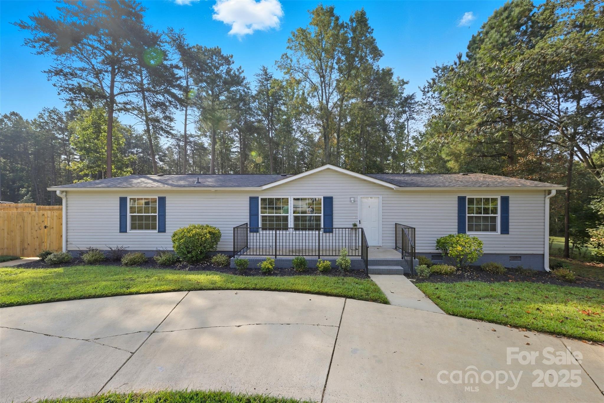 166 Brook Creek Drive Troutman, NC 28166 - Photo 3 of 26 a front view of a house with a yard and garage