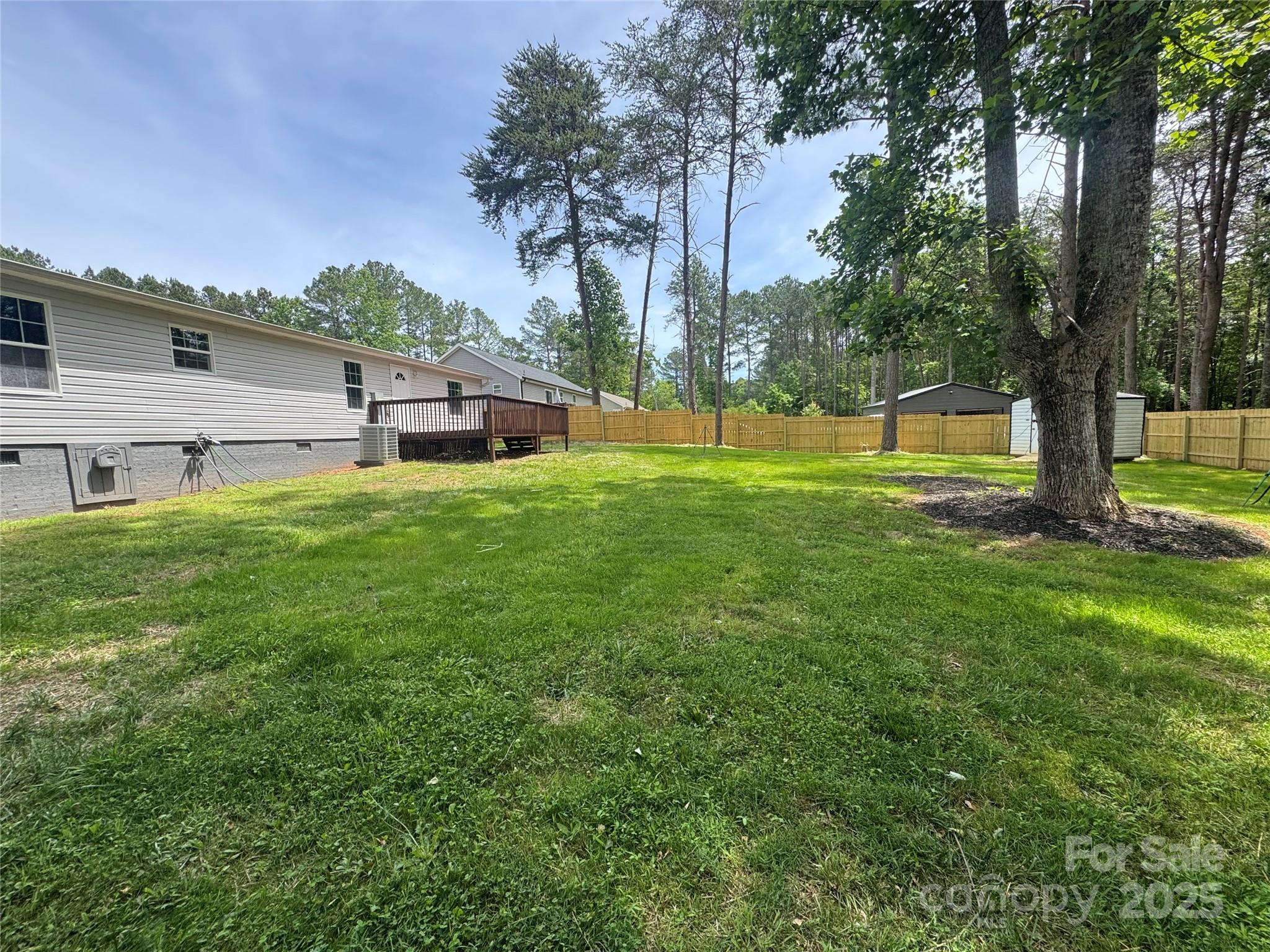 166 Brook Creek Drive Troutman, NC 28166 - Photo 7 of 26 a house view with a garden space
