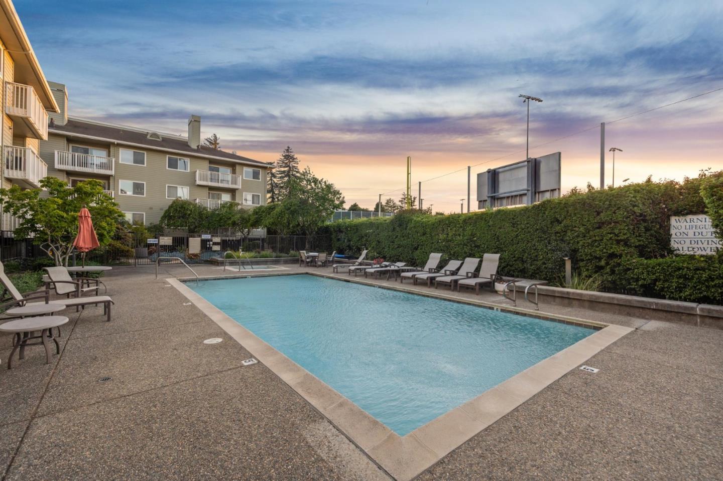 300 Murchison Drive, Unit 123 Millbrae, CA 94030 - Photo 17 of 25 a swimming pool with outdoor seating and yard