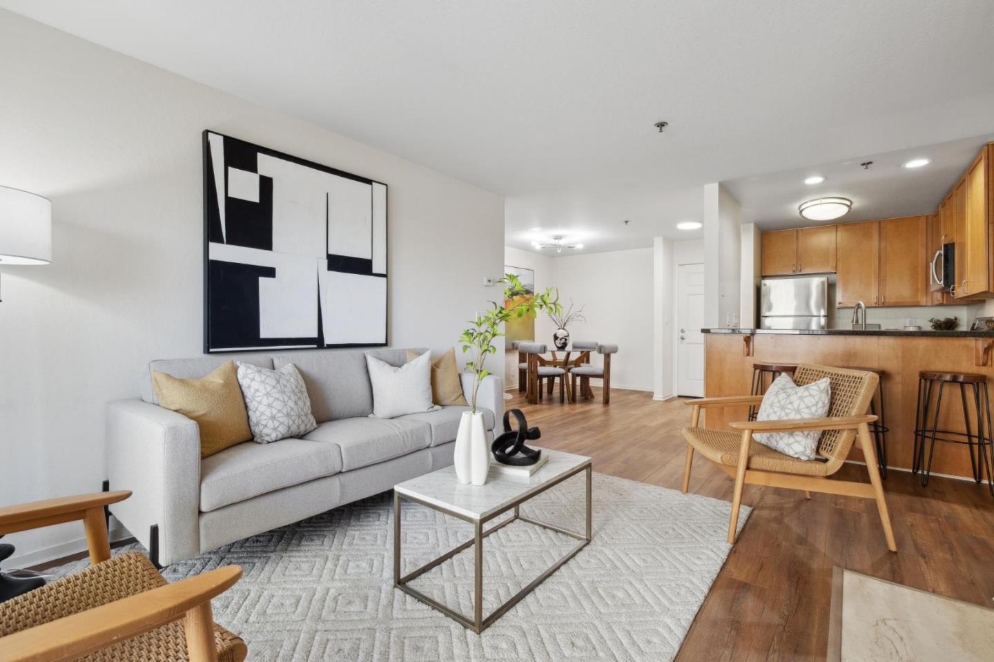 300 Murchison Drive, Unit 123 Millbrae, CA 94030 - Photo 4 of 25 a living room with furniture and kitchen view