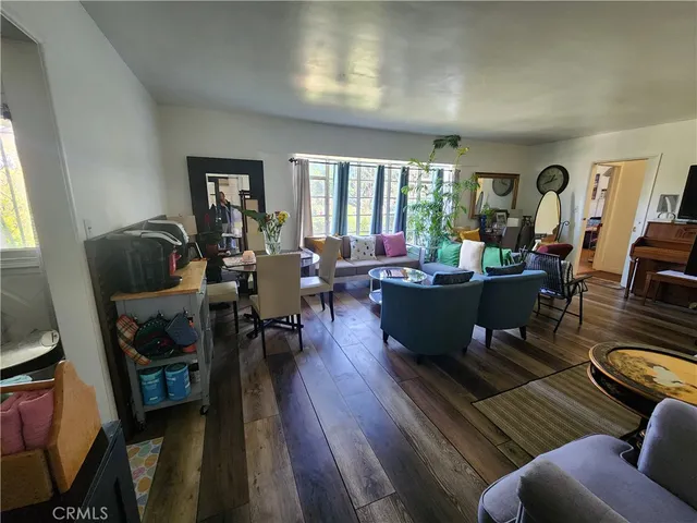 a front view of a house with a garden and porch