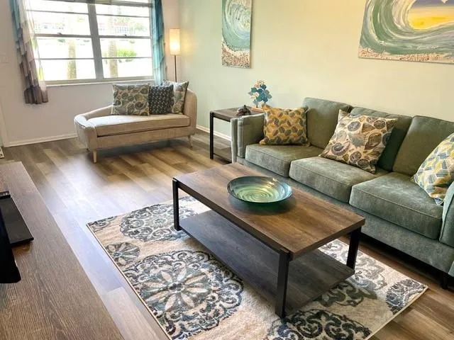 a living room with furniture and a rug
