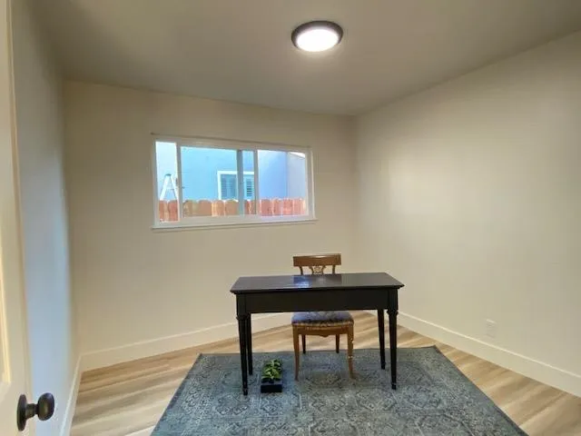 a bathroom with a shower sink vanity mirror and toilet