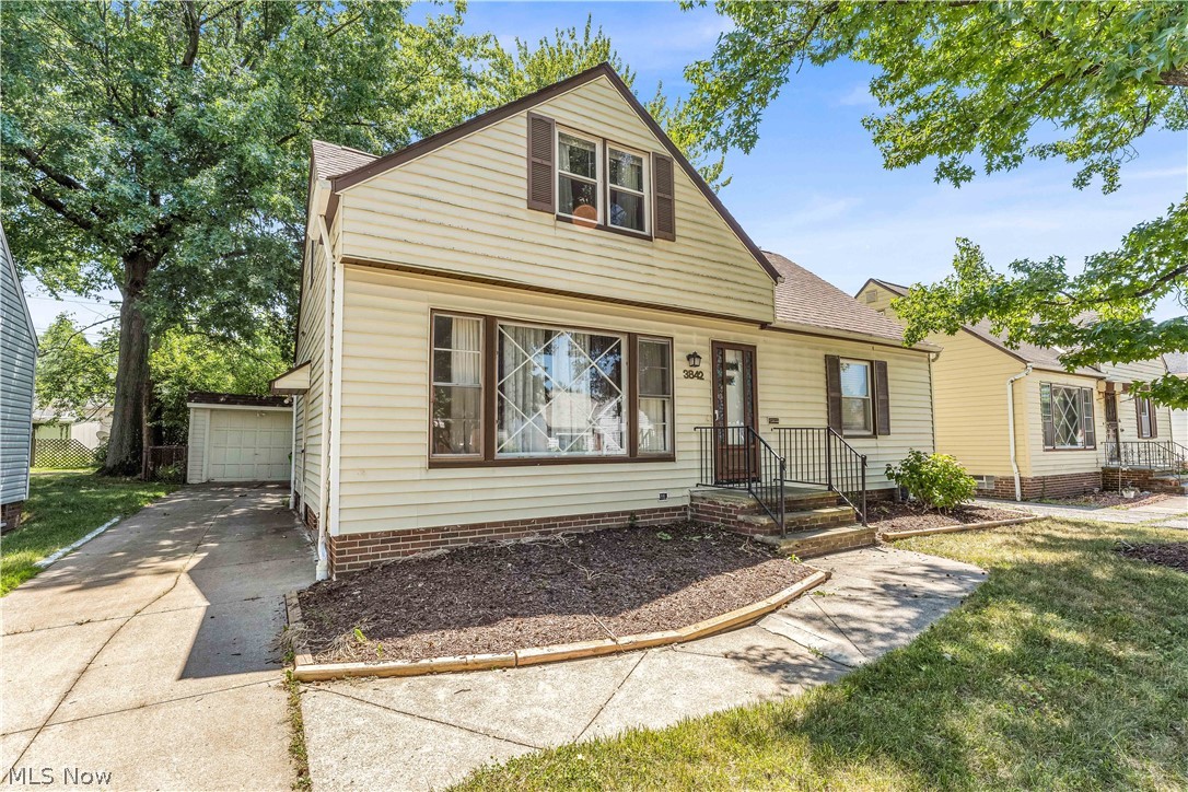 3842 Wallingford Road South Euclid, OH 44121 - Photo 2 of 31 View of front of property with a front yard, an outdoor structure, and a garage
