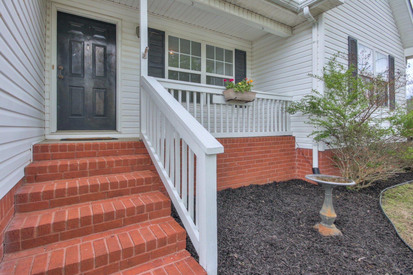 1031 Compton Road Murfreesboro, TN 37130 - Photo 20 of 21 a view of entryway with flower plants