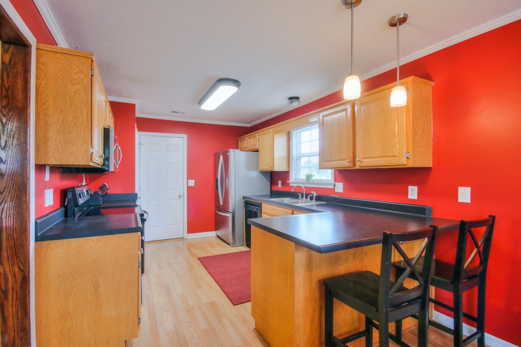 1031 Compton Road Murfreesboro, TN 37130 - Photo 3 of 21 a kitchen with stainless steel appliances granite countertop a sink and a refrigerator