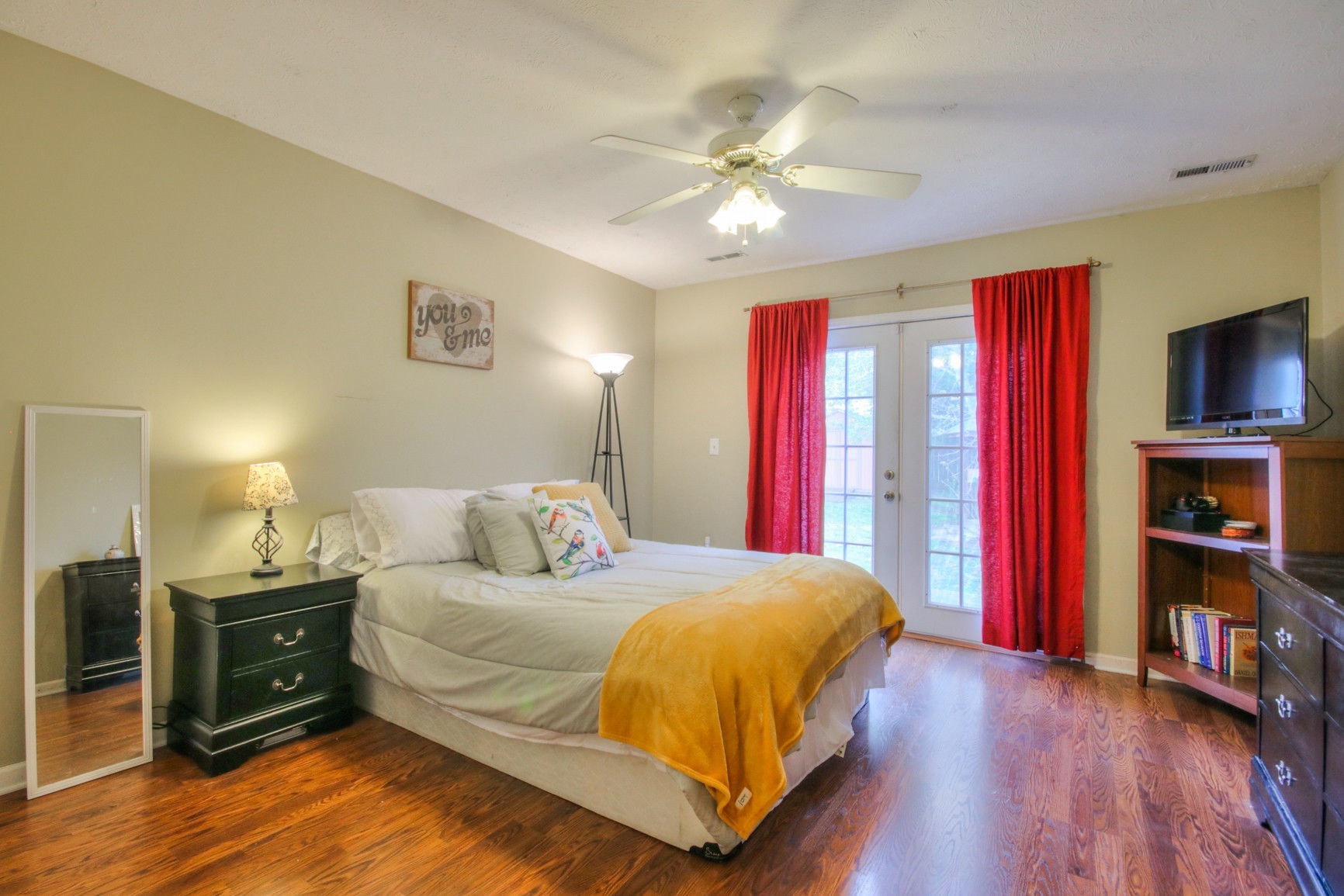 1031 Compton Road Murfreesboro, TN 37130 - Photo 7 of 21 a bedroom with a bed and a chandelier