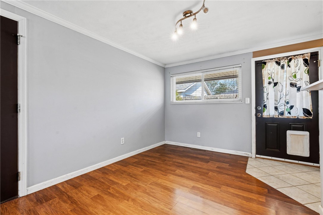 3890 Endover Road Dayton, OH 45439 - Photo 14 of 26 This versatile room features hardwood flooring and a bright window, offering a welcoming atmosphere.