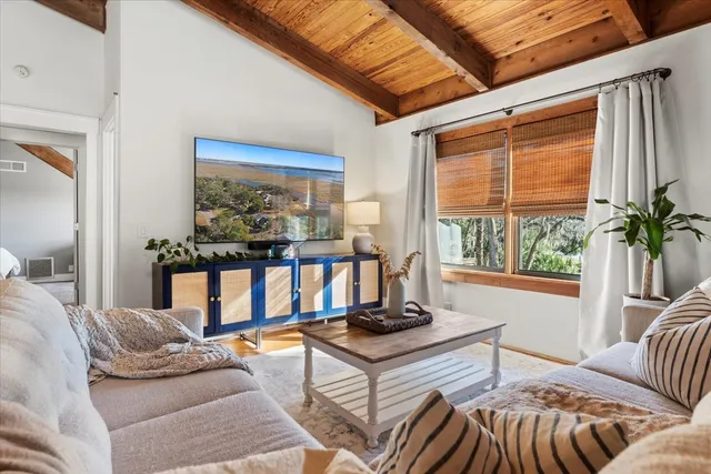 a view of a workspace with furniture and a potted plant