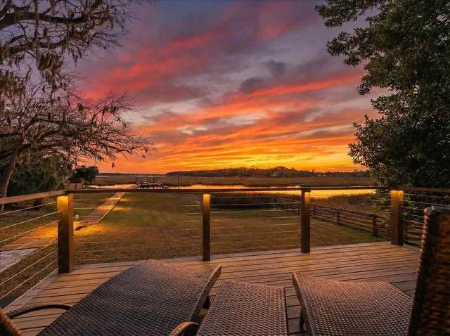 an aerial view of a house with swimming pool and garden